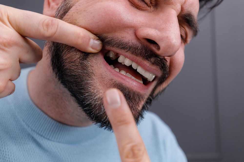 man with missing tooth after tooth extraction